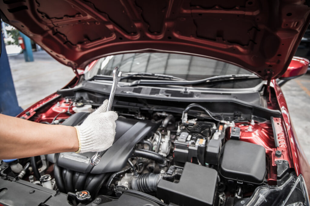 thumbs up and holding wrench of auto mechanic doin 2024 10 18 09 07 31 utc 1024x683 1